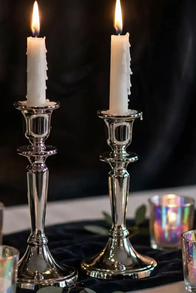 Chrome candlesticks with white tapers and opalite votives